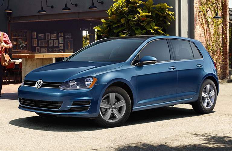 blue volkswagen golf parked outside