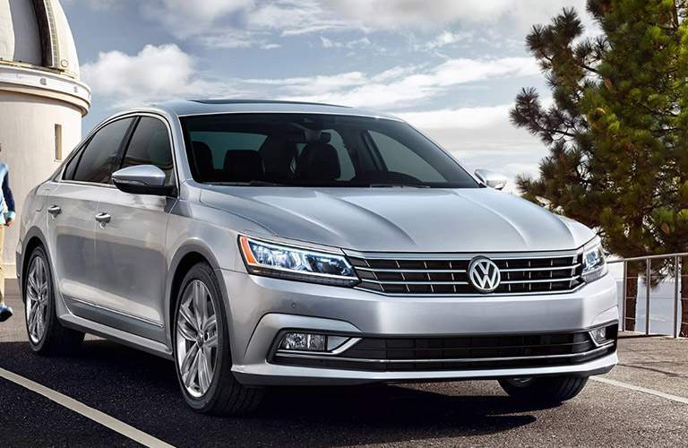 silver volkswagen passat in parking space