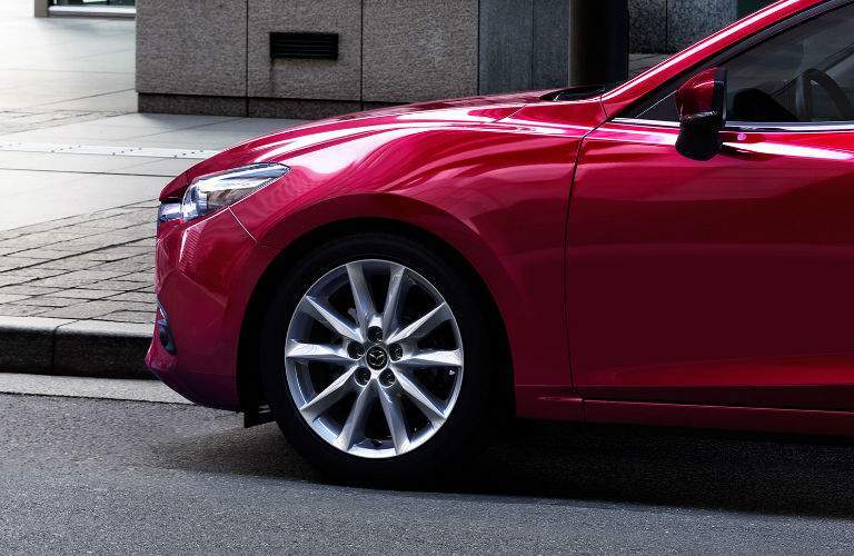 View of Side and Wheel of 2017 Mazda3 in Red