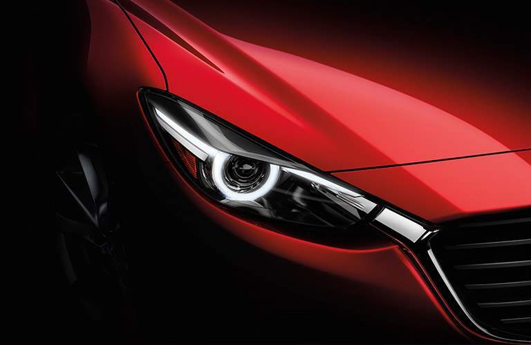 Close Up of Headlight on 2018 Mazda3 5-Door in Red