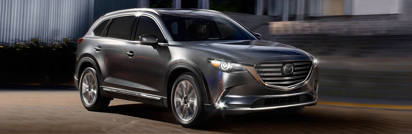 2019 Mazda CX-9 parked in front of modern building
