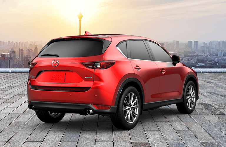 Red 2019 Mazda CX-5 Rear Exterior with City Skyline in Background