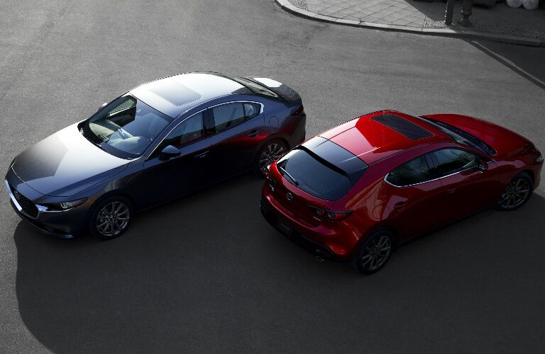 Overhead View of Gray 2019 Mazda3 Sedan and Red 2019 Mazda3 Hatchback