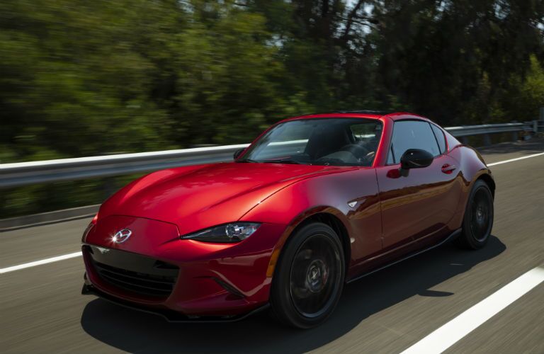 A front left quarter photo of the 2019 Mazda MX-5 Miata RF on the road.