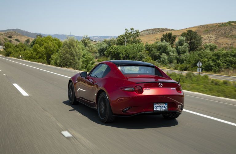 A rear photo of the 2019 Mazda MX-5 Miata RF on the road.