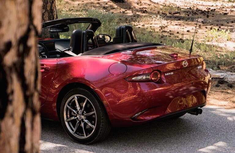 A photo of the 2019 Mazda MX-5 Miata with its soft top down.