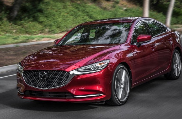 Red 2019 Mazda6 driving