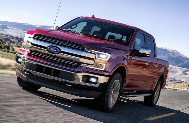 2018 Ford F-150 driving away from mountains