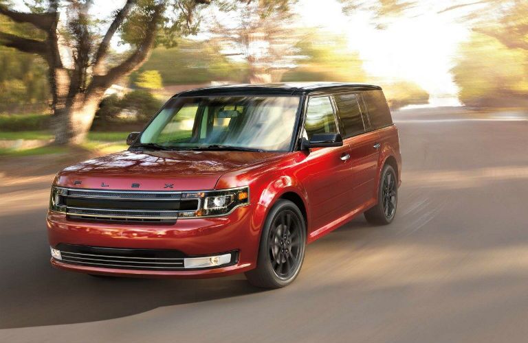 2018 Ford Flex driving during sunset