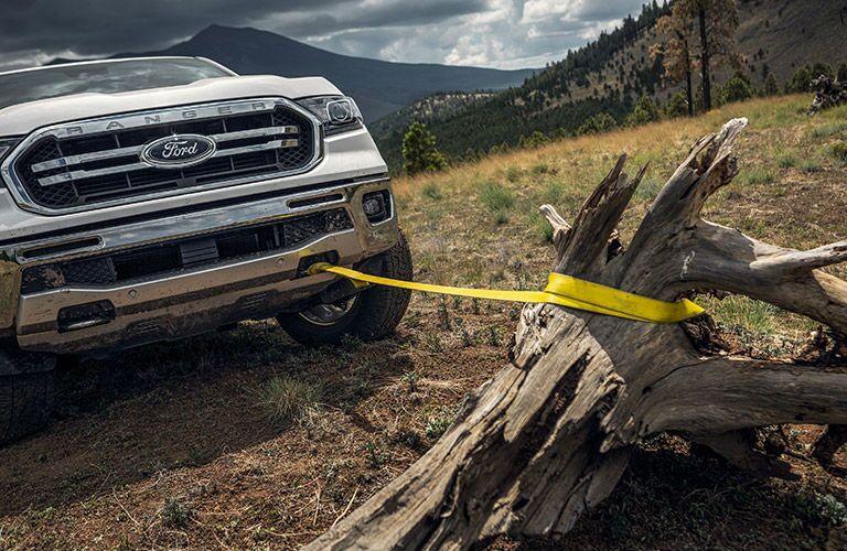 A photo of the 2020 Ranger pulling a stump out of the ground.