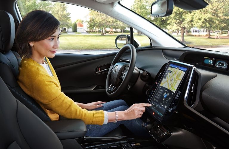 woman using touchscreen navigation in 2019 Toyota Prius
