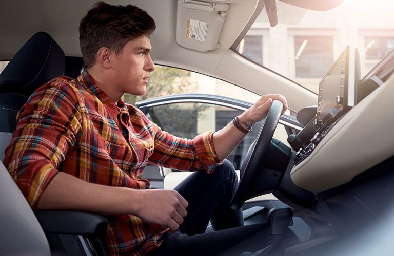 Man driving the new 2020 Toyota Corolla Hybrid