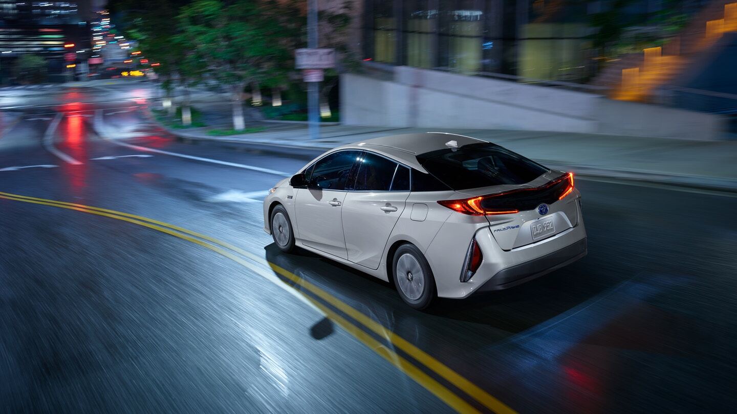Rear exterior view of a white Toyota Prius Prime