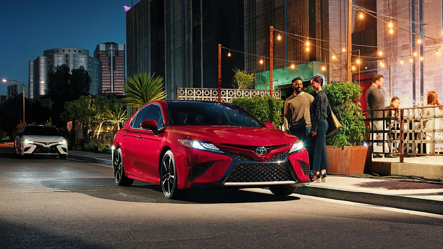 Front exterior view of a red Toyota Camry