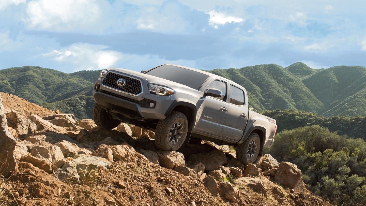 Driver side exterior view of a gray Toyota Tacoma