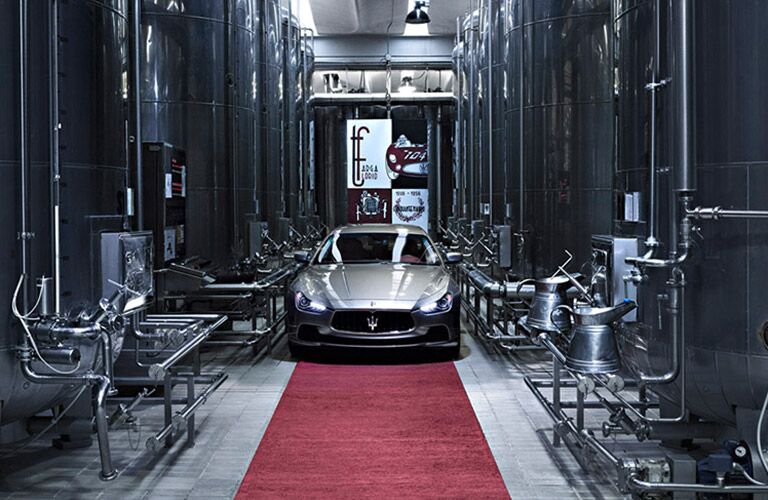 Maserati driving threateningly in a factory