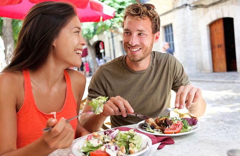 a couple having a nice meal outside
