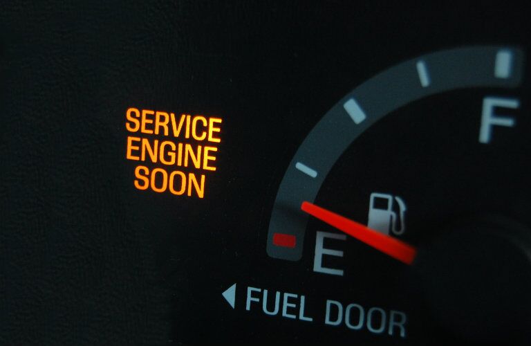 dashboard gauge warning drivers to service engine soon