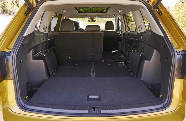 Cargo area of 2018 Volkswagen Atlas with partially collapsed seats