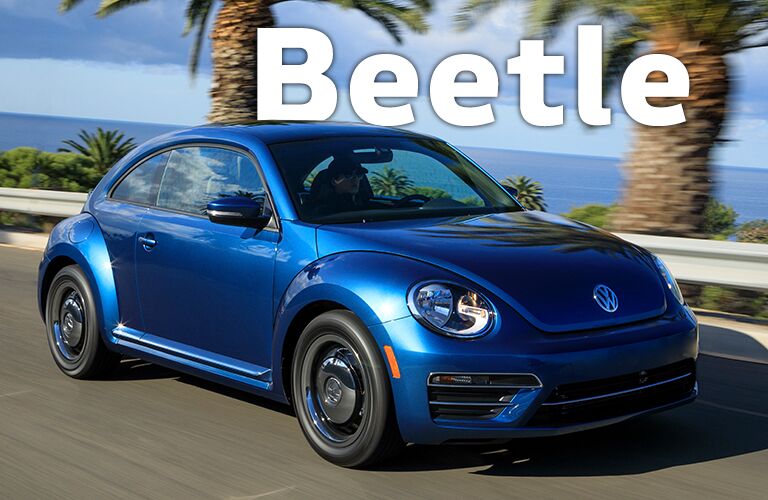 blue Volkswagen Beetle with Beetle title