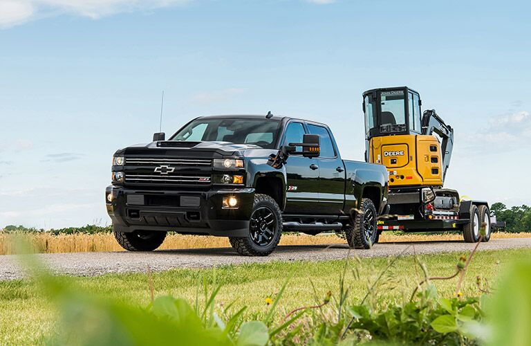 2019 Chevy Silverado 2500HD blacked out towing a trailer
