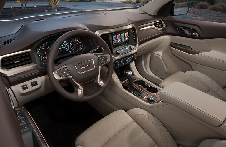 2018 GMC Acadia Denali tan leather interior with steering wheel and dash