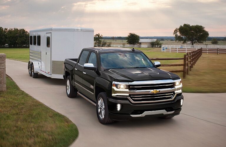 2018 Chevy Silverado 1500 black towing a trailer