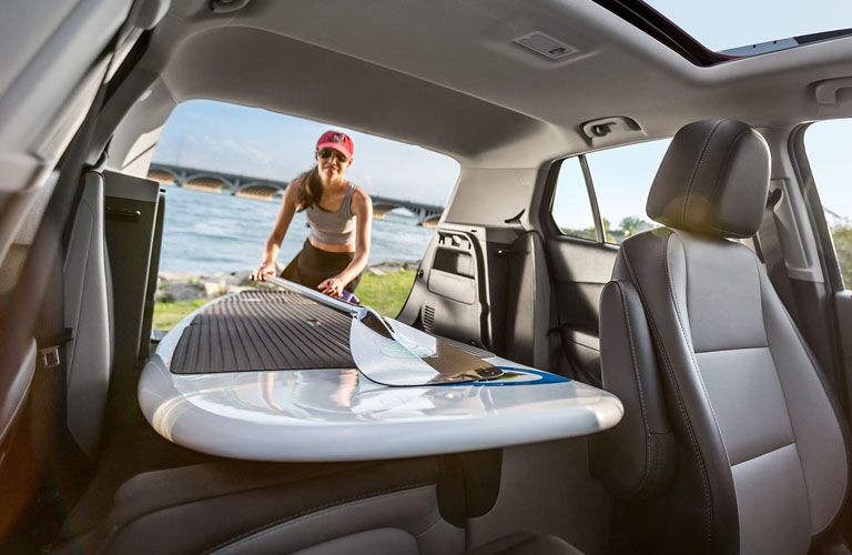 2019 Chevy Trax being loaded with a paddle board