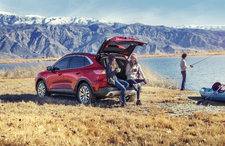 Rear view of red 2020 Ford Escape with mountains in the background