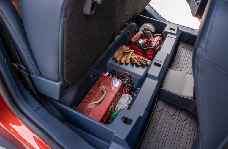 The under-seat storage in the backseat of the 2022 Ford Maverick.