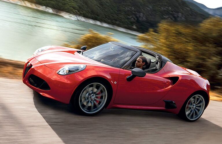 Man driving red 2018 Alfa Romeo 4C Coupe