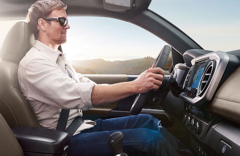 Man Sitting in the Driver's Seat of 2017 Toyota Tacoma