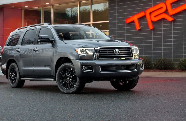 2018 Toyota Sequoia Front View of Gray Exterior in Front of TRD Sign
