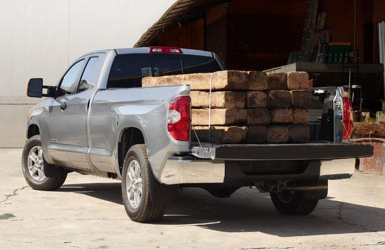 2018 Toyota Tundra Rear View of Light Blue Gray Exterior with 2x4s in the Bed