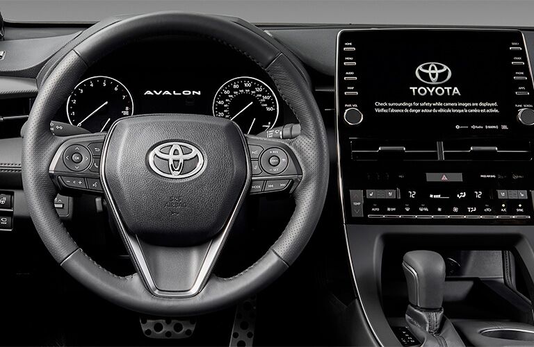 2019 Toyota Avalon View of Dashboard and Steering Wheel in Black Coloring