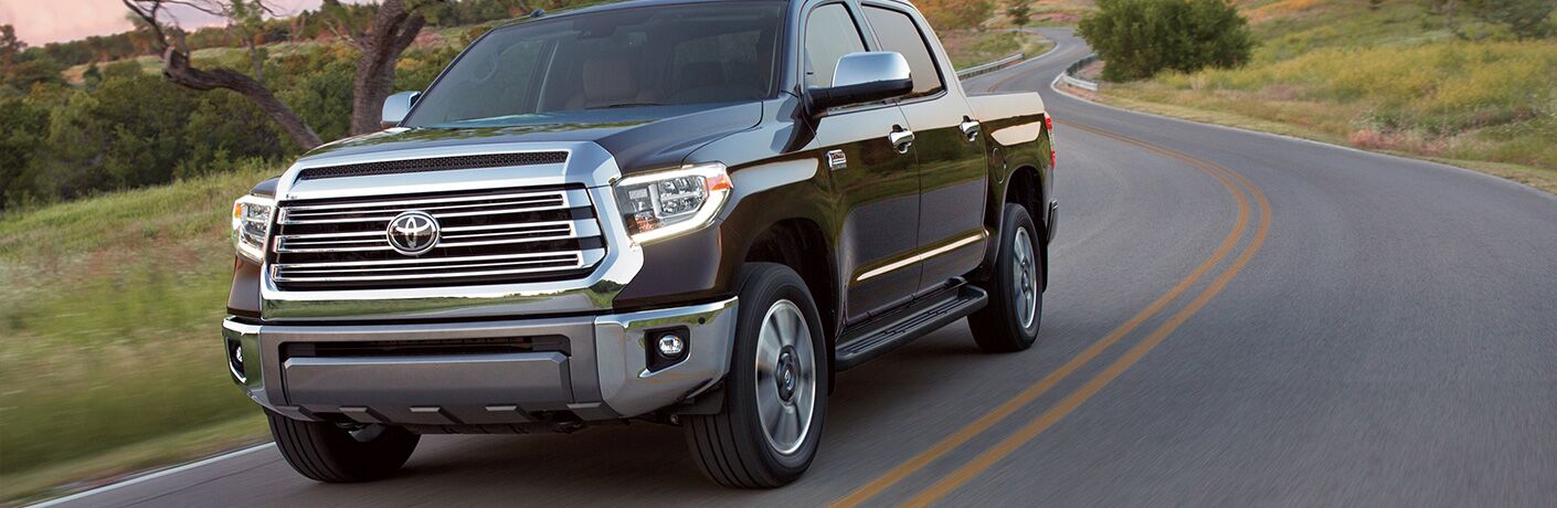 Black 2019 Toyota Tundra driving on country road