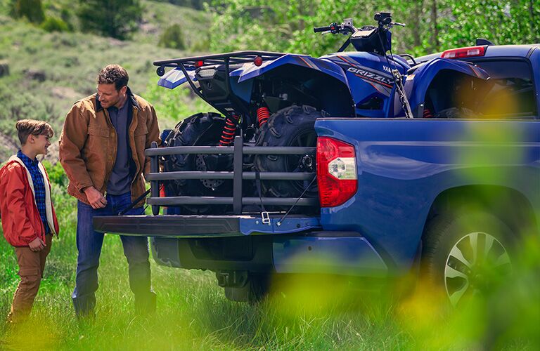 Rear view of 2020 Toyota Tundra with dirt bikes in truck bed