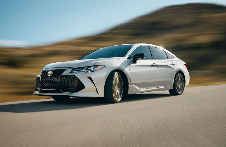 A front left quarter photo of the 2020 Toyota Avalon on the road.