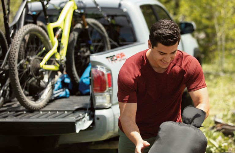 A photo of a 2020 Toyota Tacoma TRD-branded truck holding bicycles.