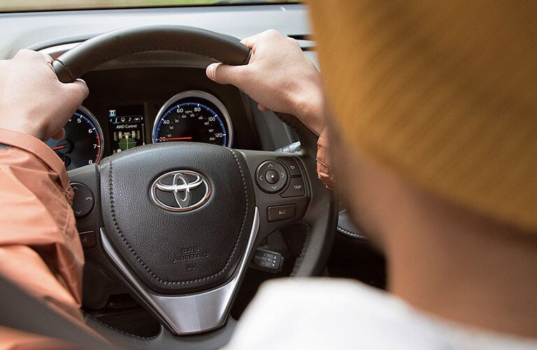 A photo of the center gauge cluster in the certified pre-owned Toyota RAV4 Hybrid.
