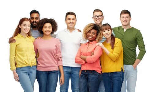 A group of friends smiling with arms around shoulders
