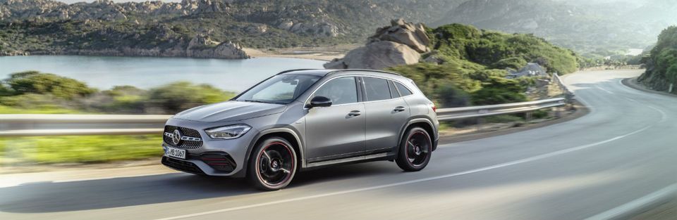 Silver 2021 Mercedes-Benz GLA drives along a highway