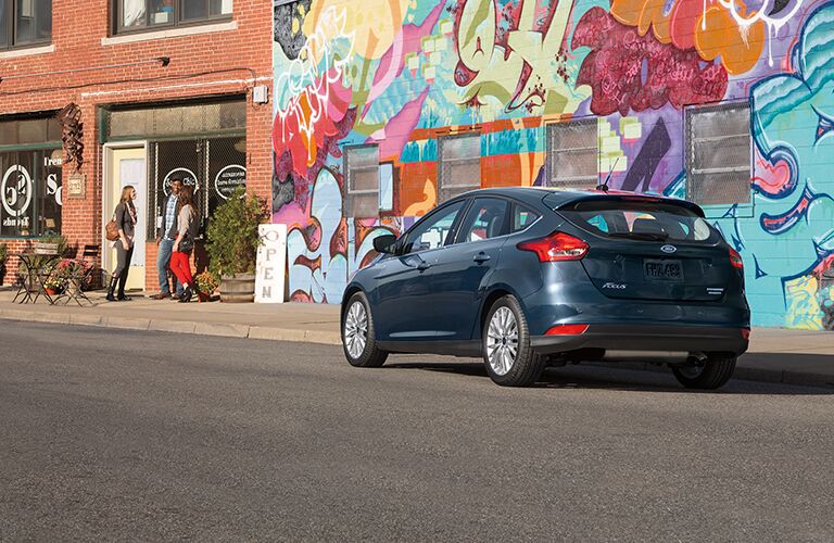 2018 Ford Focus parked near a wall of graffiti