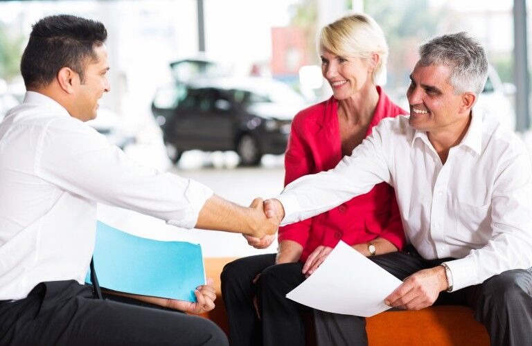 Couple purchasing a used vehicle