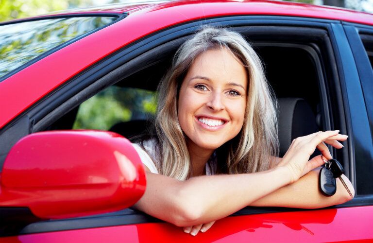 Young woman in a used Toyota vehicle