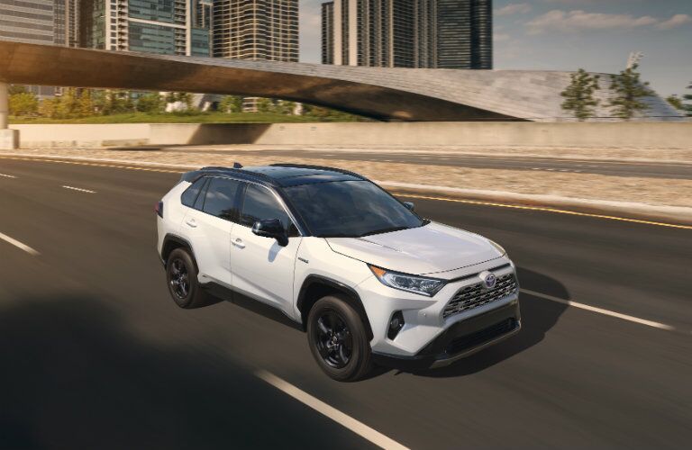 2019 Toyota RAV4 driving away from town