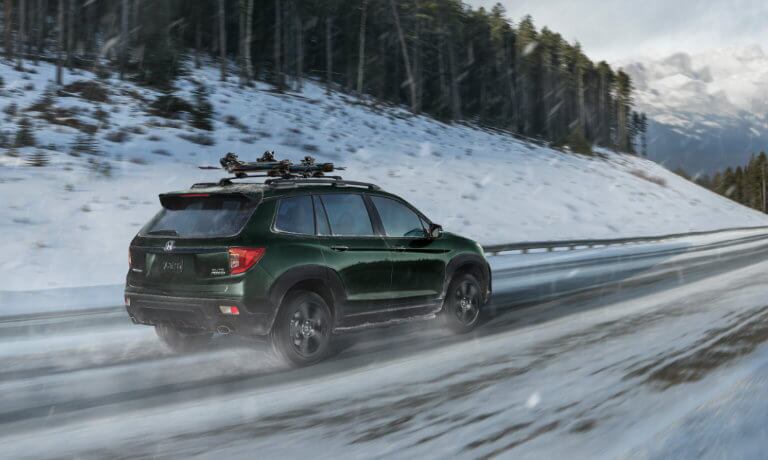 2021 Honda Passport driving through snow