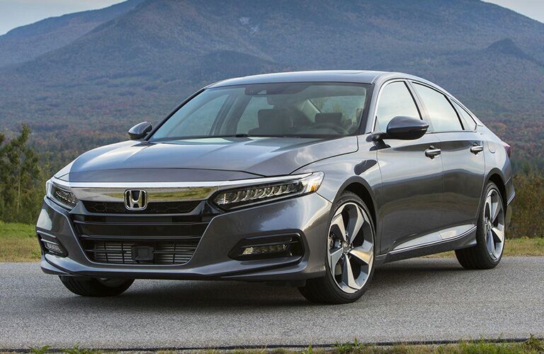 Front driver side exterior view of a gray Honda Accord