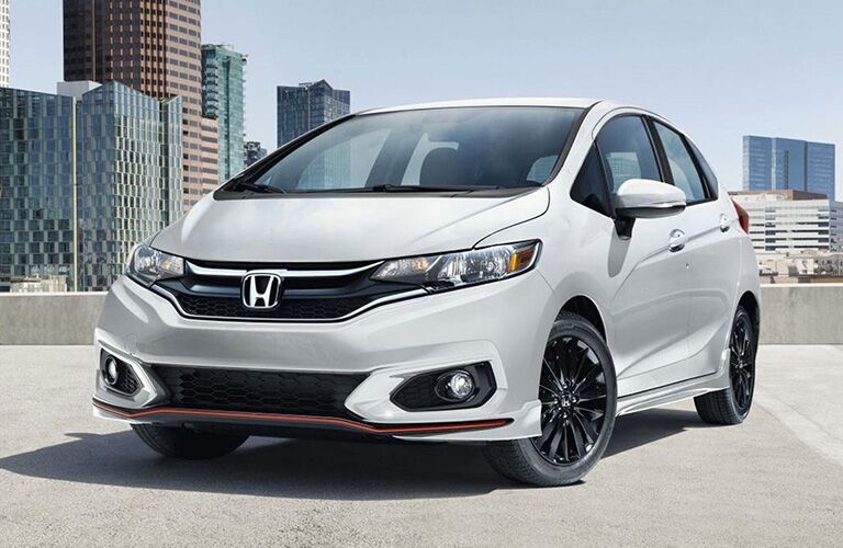 Front exterior view of a white Honda Fit