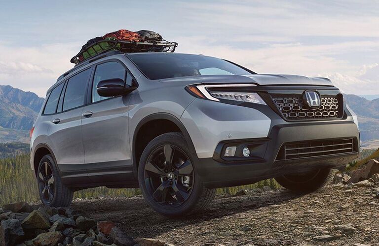 Front passenger side exterior view of a gray Honda Passport